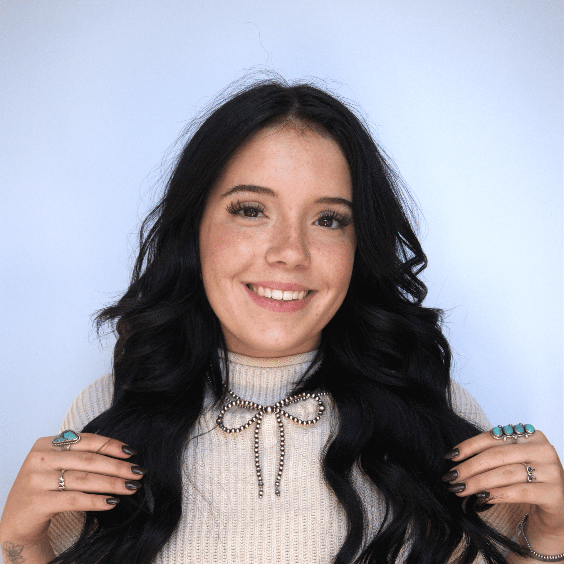 Portrait of Madison, a professional stylist at Western Blonde Salon, showcasing their expertise and style.