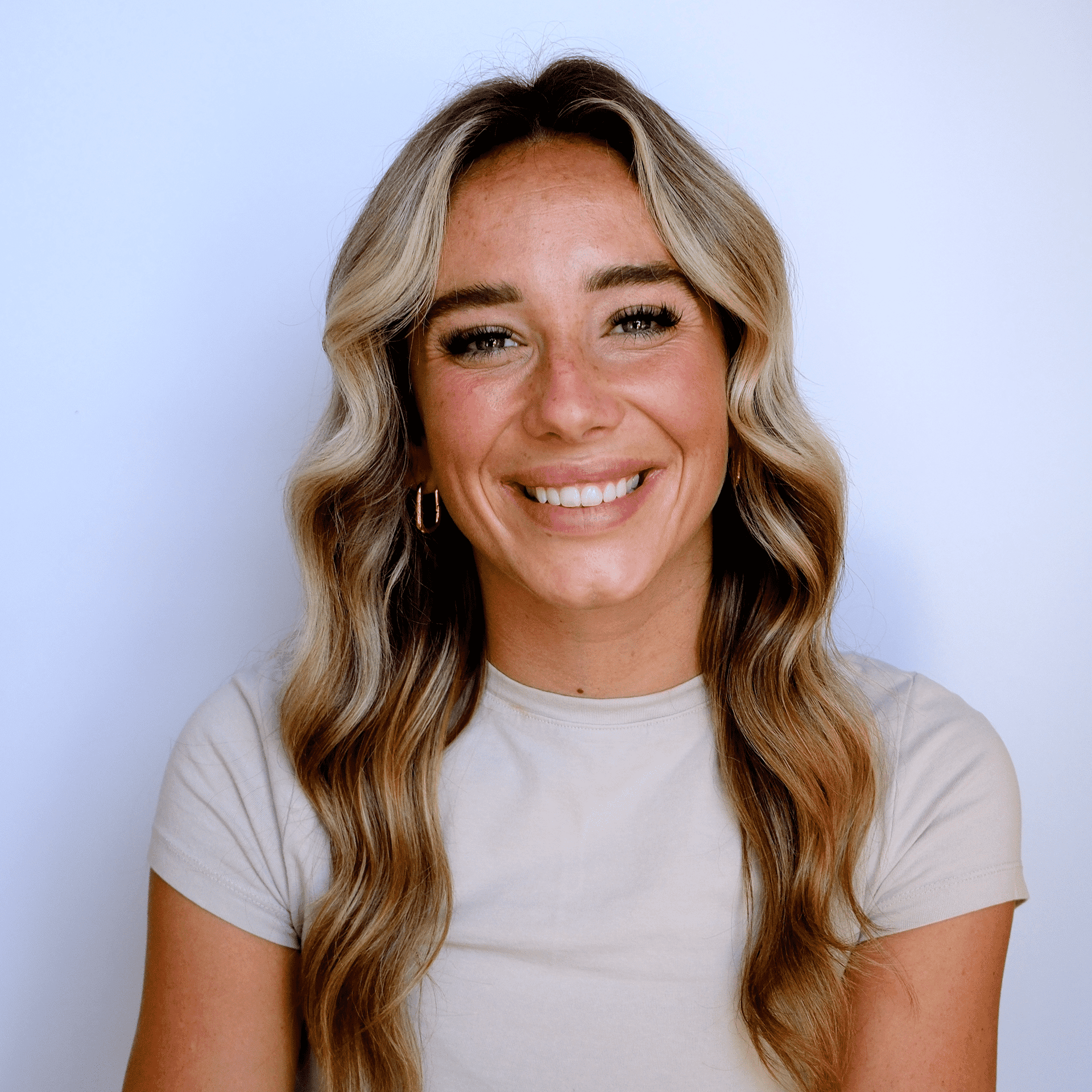 Portrait of Danyell, a professional stylist at Western Blonde Salon, showcasing their expertise and style.
