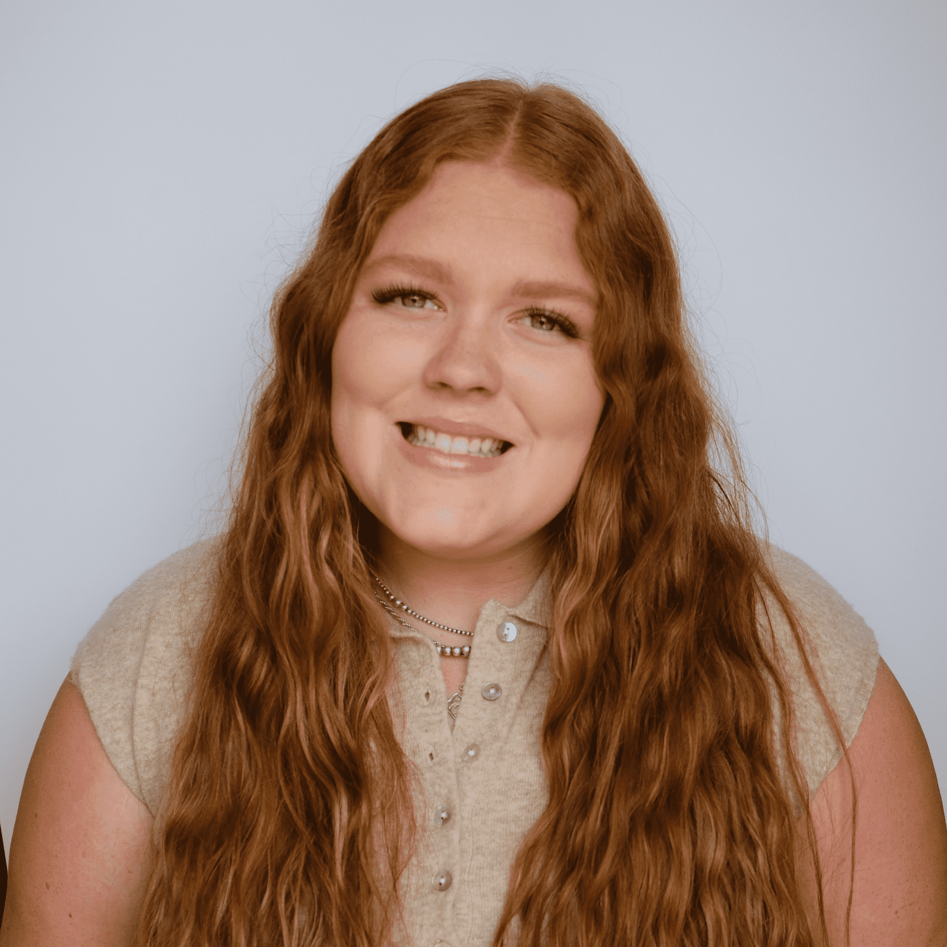 Portrait of Jayden, a professional stylist at Western Blonde Salon, showcasing their expertise and style.