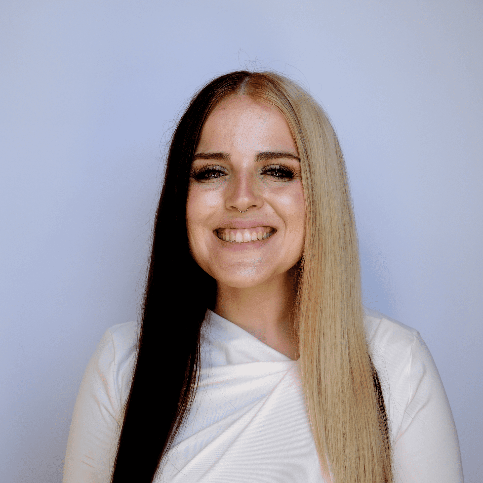 Portrait of Alexandria, a professional stylist at Western Blonde Salon, showcasing their expertise and style.