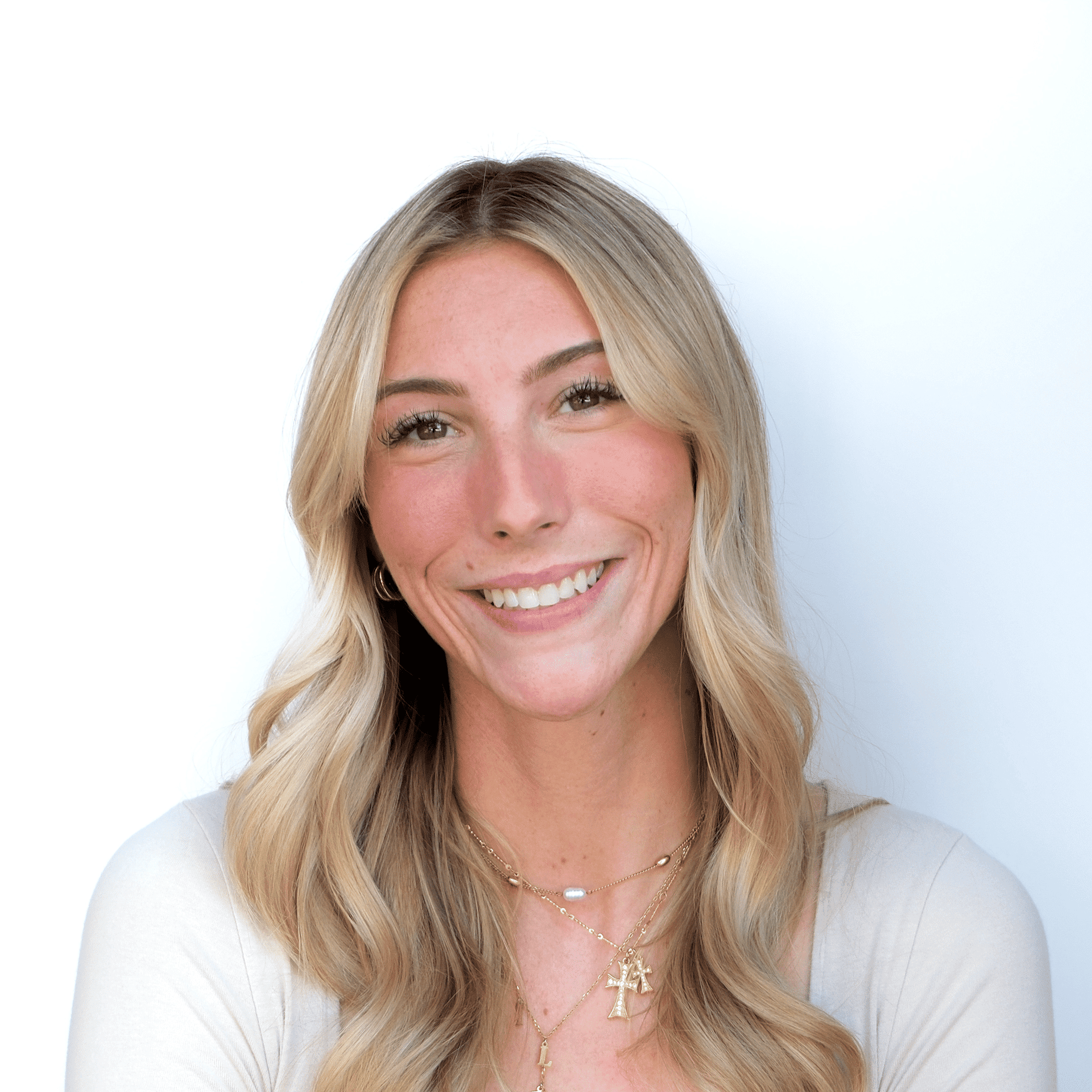 Portrait of Hailee, a professional stylist at Western Blonde Salon, showcasing their expertise and style.