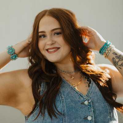 Portrait of Amber, a professional stylist at Western Blonde Salon, showcasing their expertise and style.